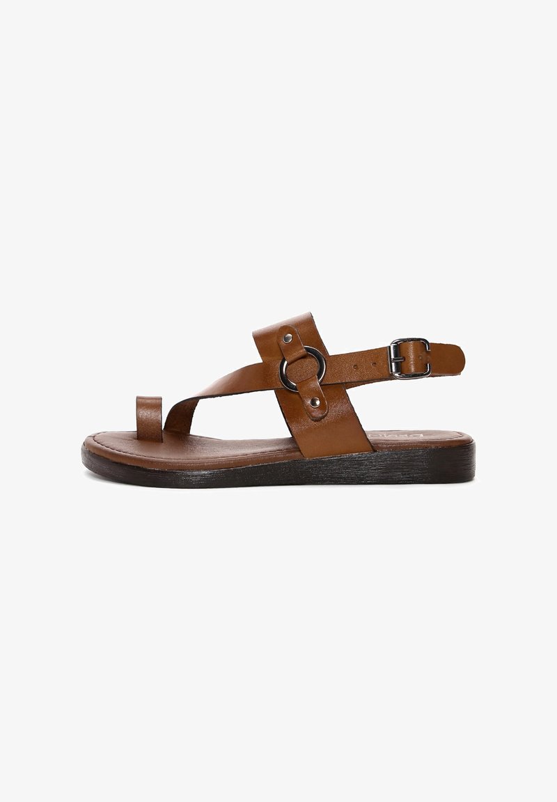 Brown leather sandal with open toe, two strap design, circular metal accent, adjustable buckle, and flat, textured black sole.