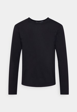 T-shirt noir à manches longues avec col rond, au design simple et ajusté, sur un fond clair uni.