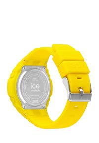 Orologio da polso in silicone giallo con cassa rotonda, retro in acciaio inox e fibbia metallica. Resistente all'acqua fino a 100 metri.