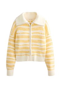 Veste zippée en maille avec une base blanc crème et de larges rayures horizontales jaunes, texture douce et grand col.