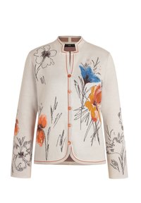 Cardigan crème avec un motif floral en bleu, orange et noir. Il présente un col rond, une fermeture à boutons à l'avant et des coutures contrastées le long des bords.