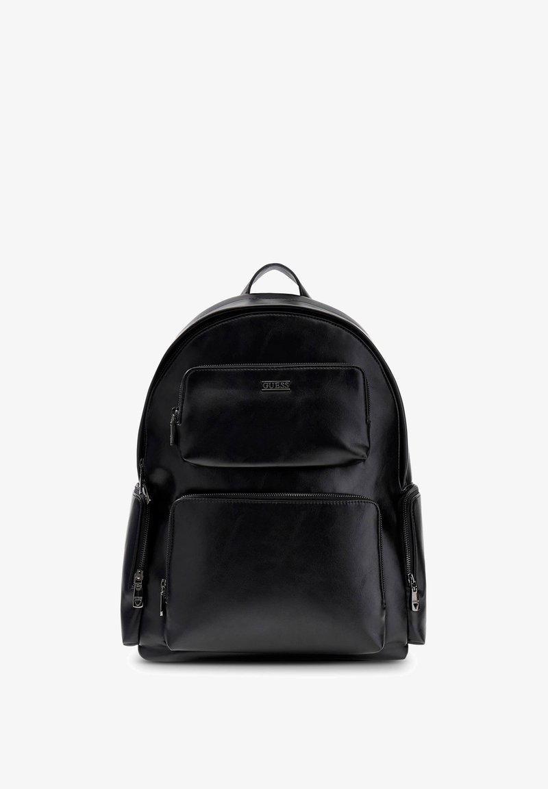 Sac à dos en cuir noir avec une forme arrondie, poche zippée à l'avant et compartiments latéraux. Présente des finitions en métal argenté et une texture subtile.