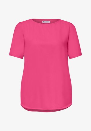 Blusa corta a maniche corte di colore rosa acceso con scollo tondo e cuciture delle spalle leggermente raccolte, con orlo curvo.