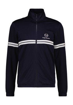 Navy zip-up jack met een textuurstof, voorzien van witte strepen over de borst en mouwen, met een logo aan de bovenkant aan de linkerkant.