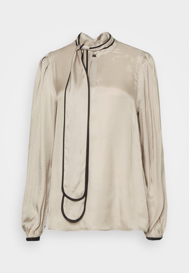 Satin blouse in light beige with a high neck and black trim. Features long sleeves, a front button, and a decorative tie at the collar.