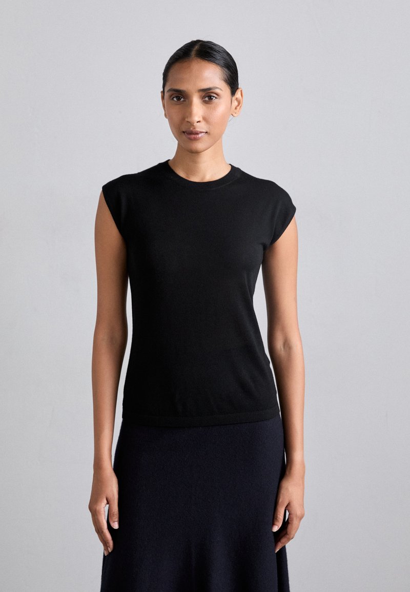 Black fitted crew neck top with short cap sleeves, crafted from smooth, lightweight fabric, featuring a clean hem and minimal design.