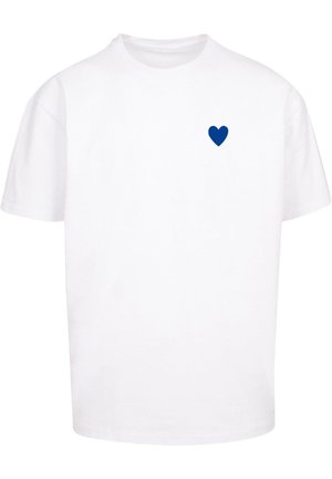 White cotton t-shirt featuring a blue heart graphic on the left chest area. Short sleeves and crew neck design.