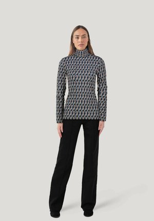 Langarm-Turtleneck-Oberteil mit geometrischem Muster in Schwarz, Weiß und metallischen Farben; enganliegendes Design mit glatter Oberfläche.