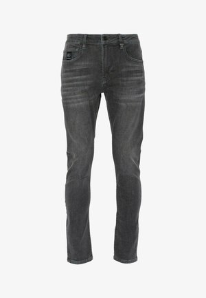 Tumedate hallid teksad, valmistatud denimist, kitsas lõige, viie taskuga disain, tagasihoidlikud kulumismustrid ja bränditud silt vööl.