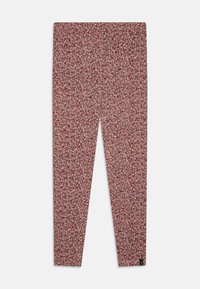 Leggings med blomstermønster som har røde og kremfargede blomster på en lyserød bakgrunn. Laget av elastisk stoff, designet for en tettsittende silhuett.