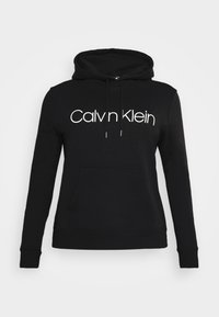 Felpa nera in cotone con tasca a marsupio e cappuccio con cordino. Presenta un logo bianco "Calvin Klein" sul petto. Tessuto liscio.