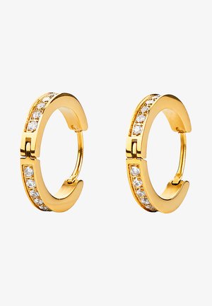 Boucles d'oreilles en or en forme de créole présentant une finition lisse avec une rangée de pierres précieuses claires et rondes sur un côté, créant un éclat subtil.