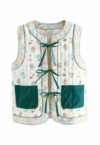 Gequilted mouwloos vest met bloemen- en Moomin-personageprint, drie groene lintstrikjes aan de voorkant en grote donkergroene voorzakken.