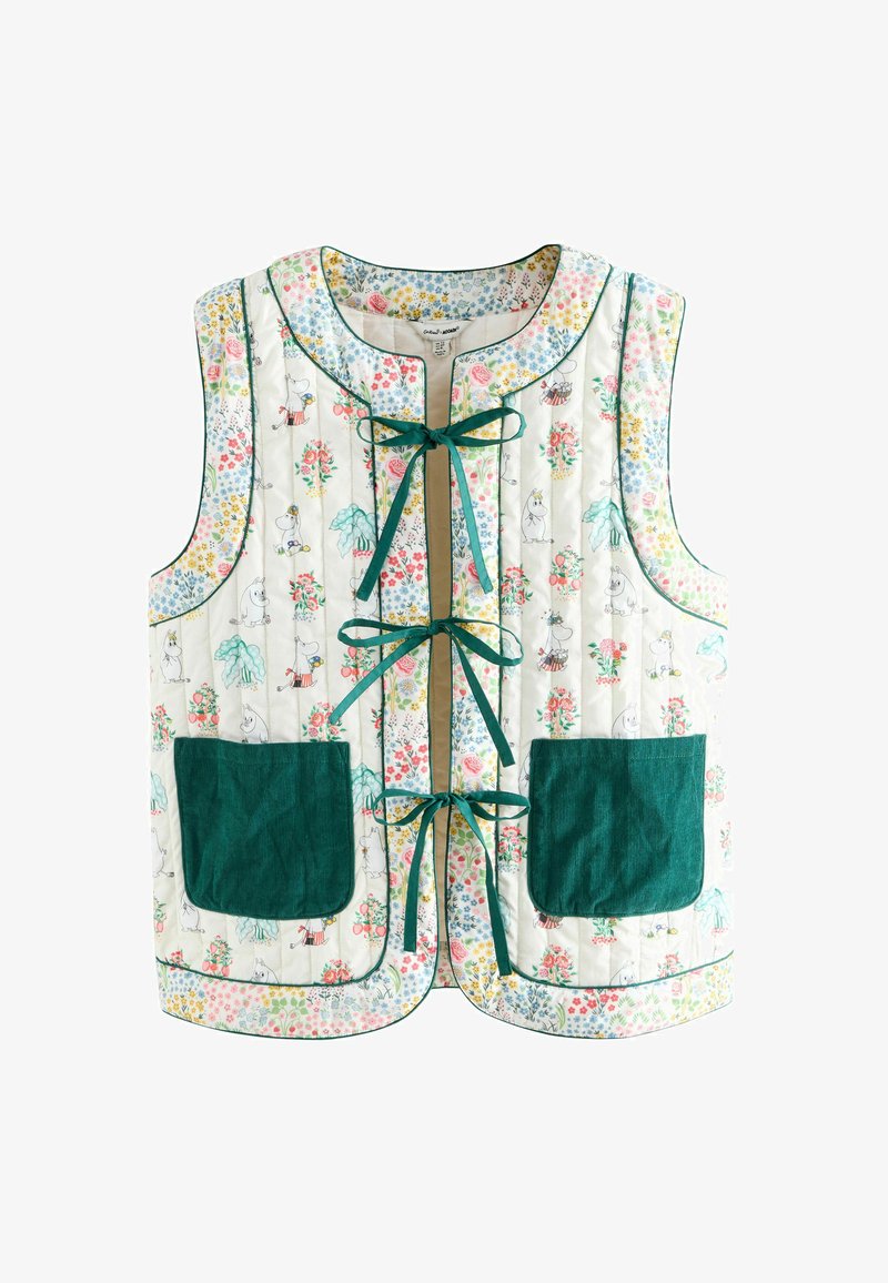 Gequilted mouwloos vest met bloemen- en Moomin-personageprint, drie groene lintstrikjes aan de voorkant en grote donkergroene voorzakken.