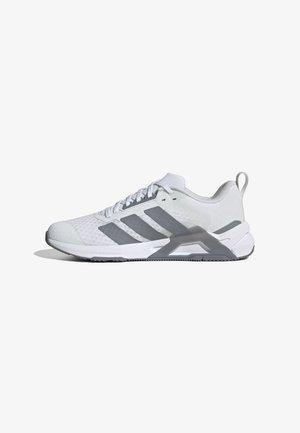 Weißer Sportschuh mit grauen Akzenten, Obermaterial aus Mesh, strukturiertem Stoff, flachen Schnürsenkeln und einer stützenden Ferse. Stabiler Gummilaufsohle.