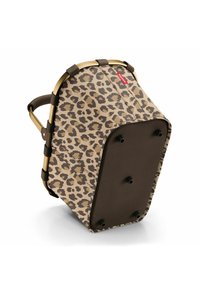 Panier en imprimé léopard avec une base beige, des accents bruns et un cadre en métal doré. Présente une conception robuste avec quatre pieds noirs en bas.