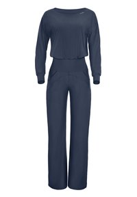 Navy blue jumpsuit with long sleeves, rounded neckline, and wide leg design. Features a fitted waistband and front pockets for added detail.