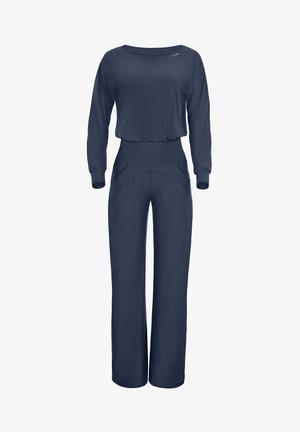 Marineblauer Jumpsuit mit langen Ärmeln, rundem Halsausschnitt und weitem Bein. Besitzt eine taillierte Taille und vordere Taschen für zusätzlichen Detailreichtum.