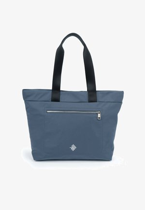 Sac fourre-tout en tissu bleu foncé avec des poignées noires, comportant une poche zippée à l'avant et un logo subtil dans le coin.