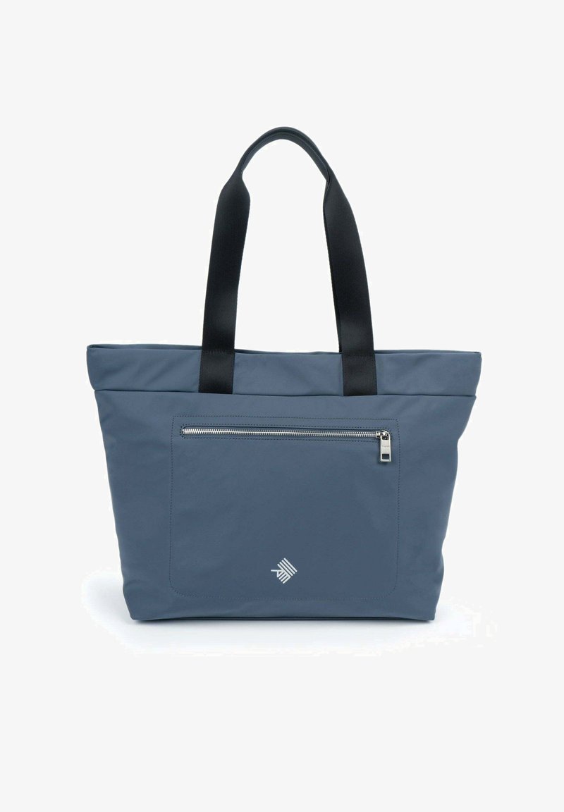 Sac fourre-tout en tissu bleu foncé avec des poignées noires, comportant une poche zippée à l'avant et un logo subtil dans le coin.