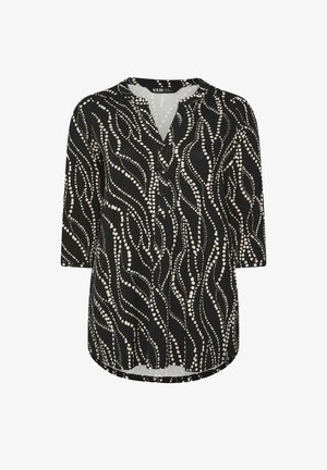 Tunique noire avec décolleté en V et manches trois-quarts, ornée d'un motif en vagues à pois crème. Détail de patte de boutonnage à l'avant.