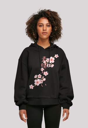 Black hoodie with a loose fit, featuring pink cherry blossom graphics and Japanese text. Made from cotton blend with a soft texture.