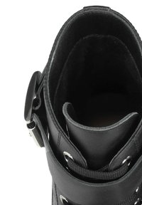 Black leather boot featuring a rounded top with a smooth texture, lace-up closure, and metallic accents. Open interior view displayed.