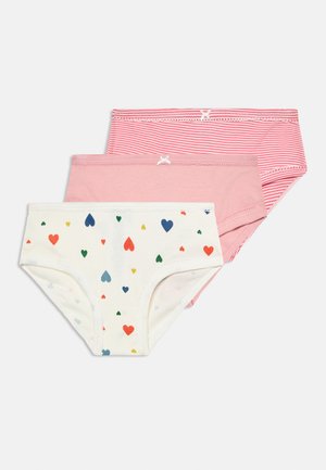 Tre par med jenters bomullsunderbukser i hvitt med multicolor hjerter, ensfarget rosa og rosa med hvite striper, hver med en liten sløyfe foran.