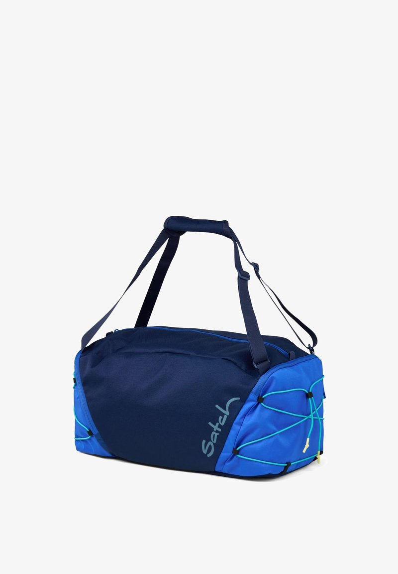 Blue and navy duffel bag made of durable fabric. Features adjustable straps, a zip closure, and decorative elastic cords on one side.