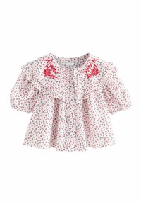 Weißer Blusen mit rotem Blumenmuster, gerafften Schultern und Knopfverschluss. Sie hat kurze Puffärmel und dekorative Stickerei.