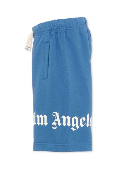 Short en coton bleu avec taille élastique, cordon blanc, poche latérale et inscription "Palm Angels" en police Old English blanche près de l'ourlet.