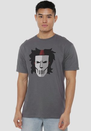 Gray cotton t-shirt featuring a graphic of a stylized warrior face with black hair, white skull-like features, and a red accent on the forehead.