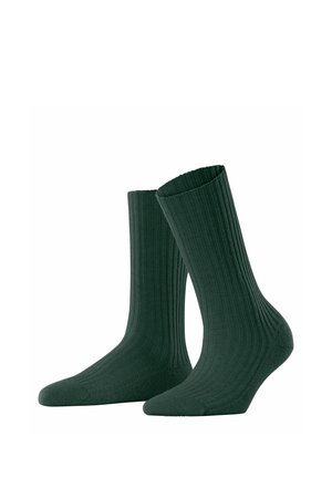 Par de calcetines de media caña acanalados de color verde oscuro, mostrados en posición vertical sobre fondo blanco.