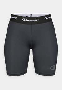 Svarta träningstights med Champion-logotyp och Combat-märke på ett brett midjeband. Tillverkade av ett mjukt, elastiskt material.