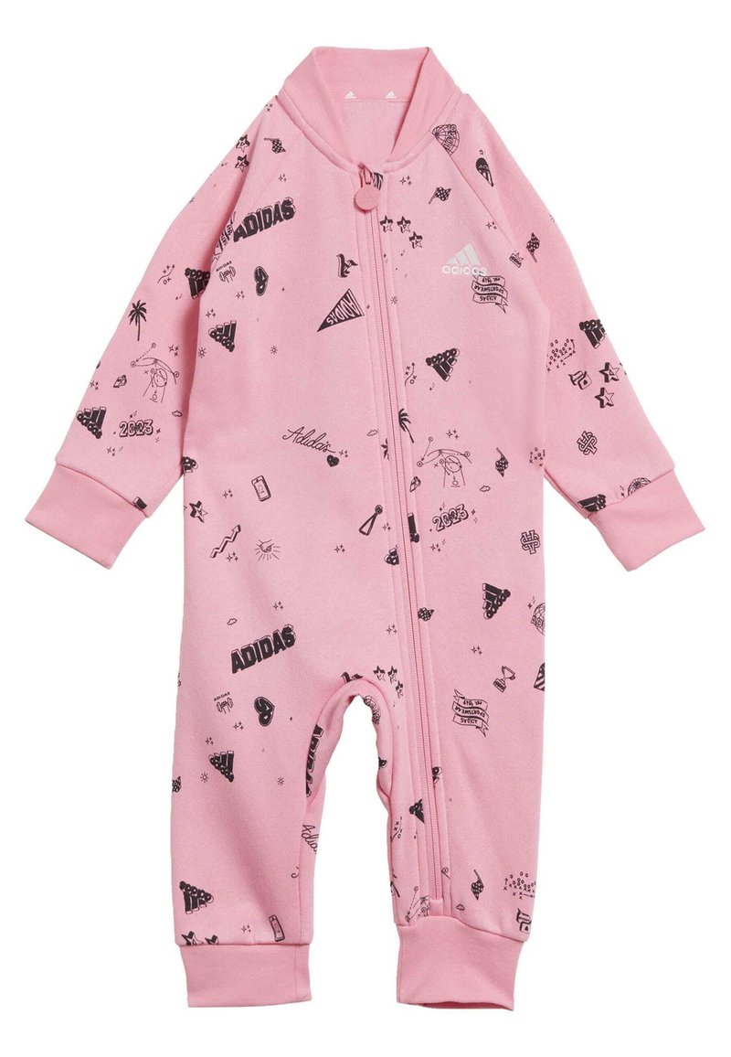 Pink onesie made of soft fabric, featuring black graphic prints including shapes and logos, with a front zipper and cuffed sleeves.