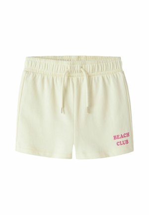 Kremowe, casualowe szorty z elastycznym pasem, sznurkiem, kieszeniami bocznymi i różowym napisem "BEACH CLUB" na lewej nogawce.