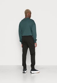 Jack & Jones JPSTGORDON JJSHARK   - Pantalones deportivos - black