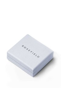 Scatola regalo Rosefield in cartone azzurro chiaro, forma quadrata, caratterizzata da una superficie liscia e con il nome del marchio stampato in nero.