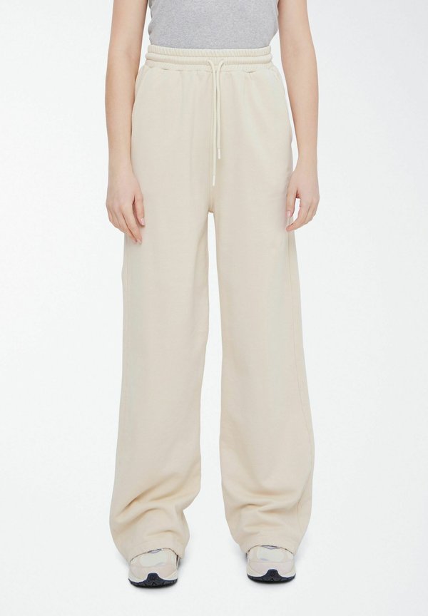 BASIMONA - Tracksuit bottoms - summer sand