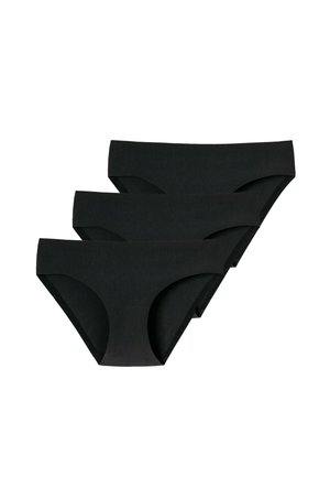 Trois culottes noires sans coutures de style bikini pour femmes empilées sur un fond blanc.