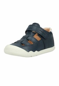 Navy blue toddler sandal with white sole, closed toe, cut-out sides, and adjustable hook-and-loop strap on a white background.