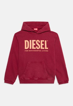 Червена суичър с качулка с преден джоб и голям бежов текст "DIESEL for successful living" отпред.