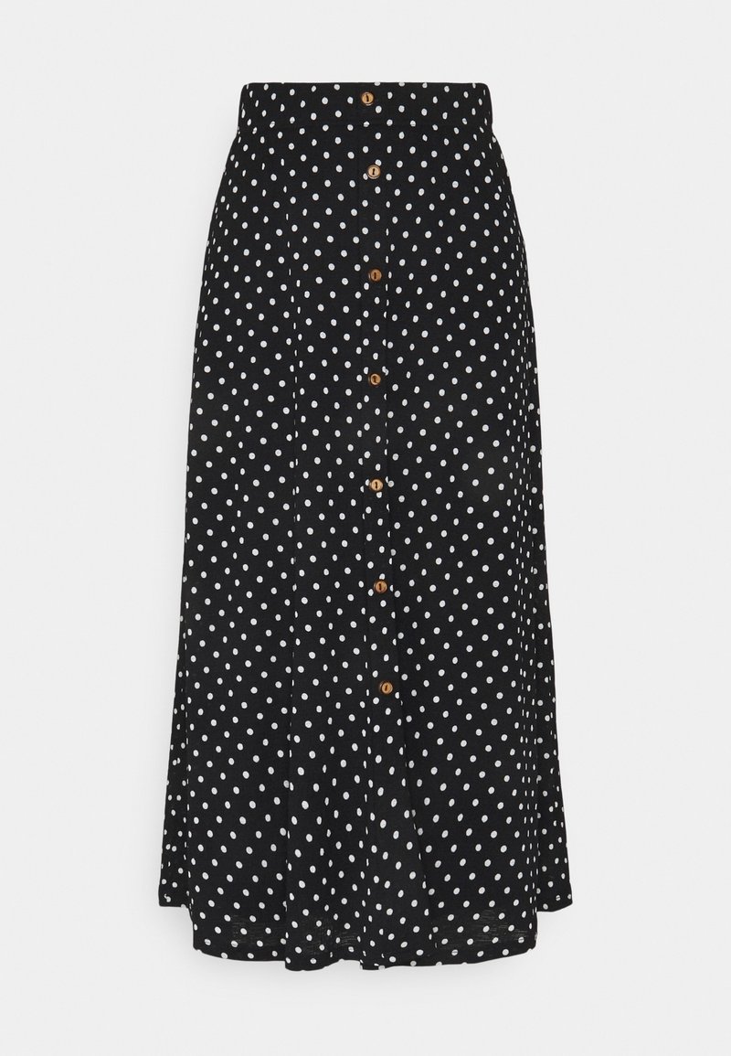 Jupe noire à pois blancs avec une fermeture à boutons à l'avant dotée de boutons en bois, et une texture de tissu lisse. Silhouette en A.