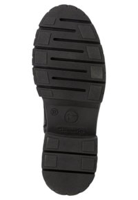 Semelle de chaussure en caoutchouc noir avec des rainures profondes et plusieurs motifs de semelle, marquée de la taille 37 et du logo de la marque, avec une finition texturée.