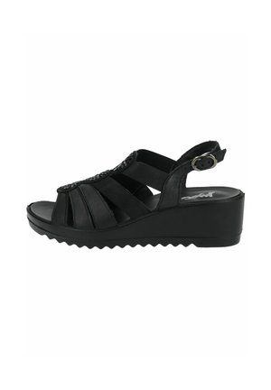 Black wedge sandals with multiple cross straps, a textured surface, adjustable ankle strap, and a ridged sole for grip.
