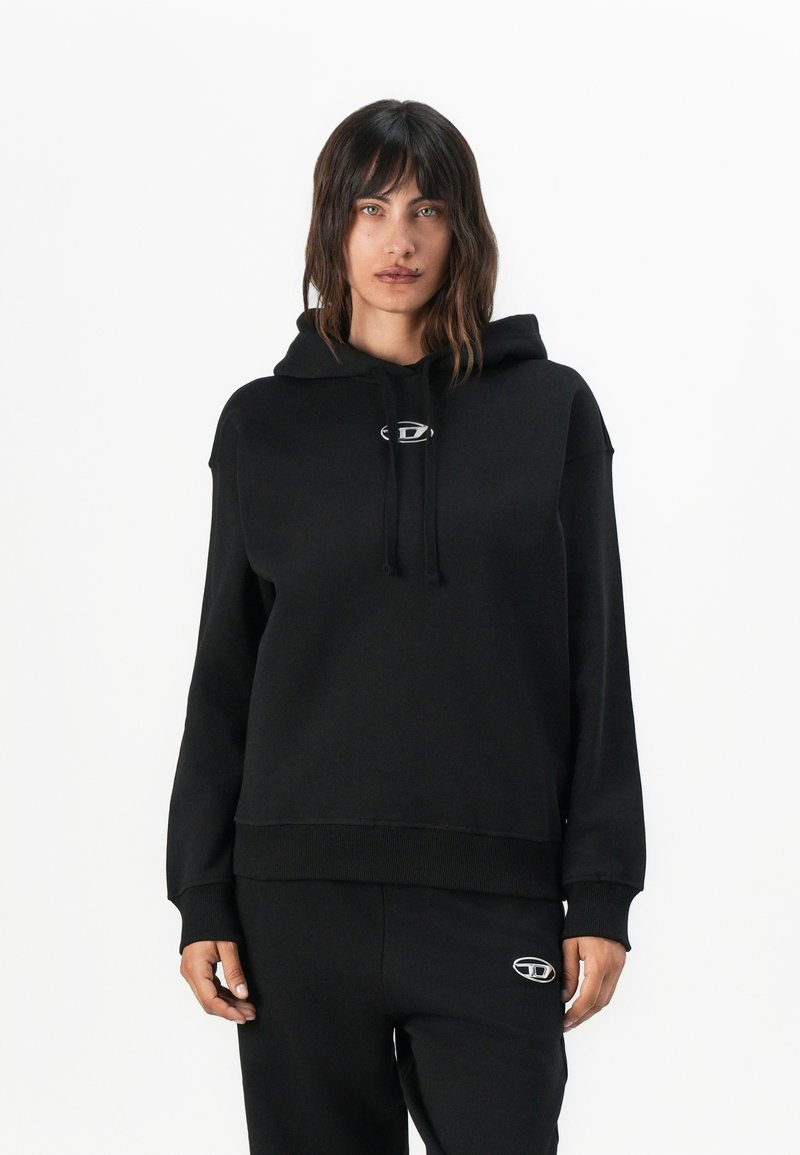 Black hoodie in soft fabric with a drawstring and logo detail on the chest. Features a relaxed fit and ribbed cuffs and hem.