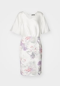 Robe blanche avec un corsage en soie et des manches courtes évasées. La jupe présente un motif floral dans des tons de rose, violet et vert. Taille élastique.