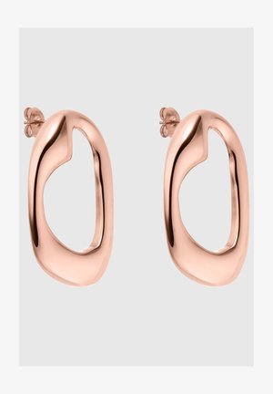 Pendientes de oro rosado con forma ovalada abstracta y diseño recortado. Textura suave, acabado pulido y cierre tipo tuerca.