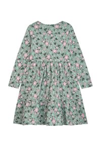 Grünes Blumenkleid mit langen Ärmeln, verziert mit pinken Blumen, schwarzen Akzenten und einem gestuften Rock. Weiches Baumwollmaterial mit rundem Ausschnitt.