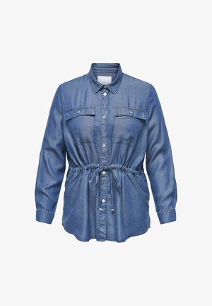 Denimová košile v tmavě modré barvě, dlouhé rukávy, zapínání na knoflíky, mašle v pase, dvě náprsní kapsy a pevná textura s uvolněným střihem.